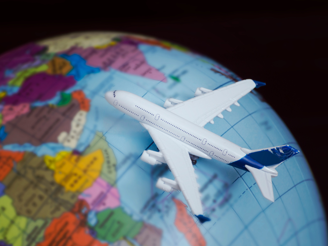 Plane over globe